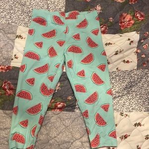 Teal leggings with watermelons. Mid length.